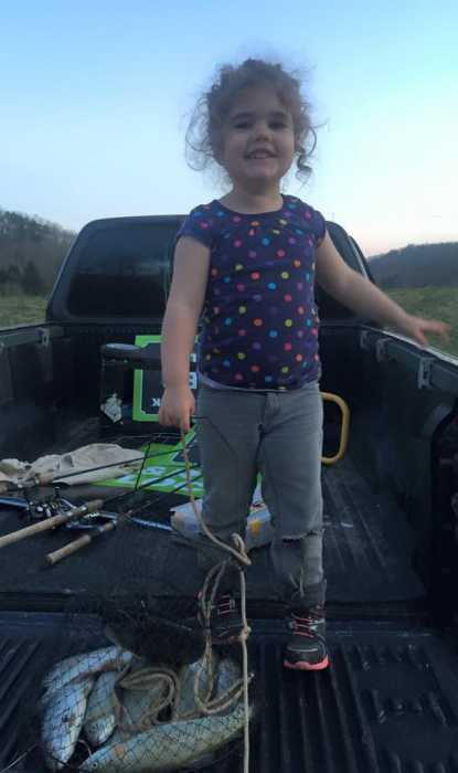 This is Jessalyn, age 3. Her and her sister caught their daily limit of trout at Miller's Fork Pond in Wayne County, West Virginia. Date March 25
