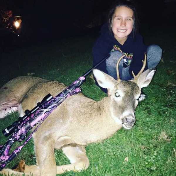 Trinity with her first buck harvested in Charleston.